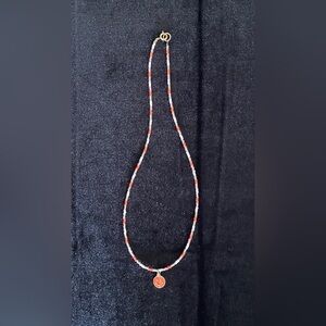 Handmade beaded necklace with smiley face charm